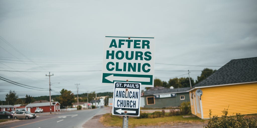 A poetic outdoor signpost at a crossroads with multiple arrow plates, each clearly labeled with a redirect code—