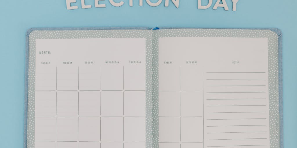 A whimsical scene showing a chrome robot (a generic 'web crawler' figure) walking across an oversized paper calendar that is laid on top of a stylized website mockup. The robot leaves small glowing footprints that align with calendar dates; some dates are brightly stamped 