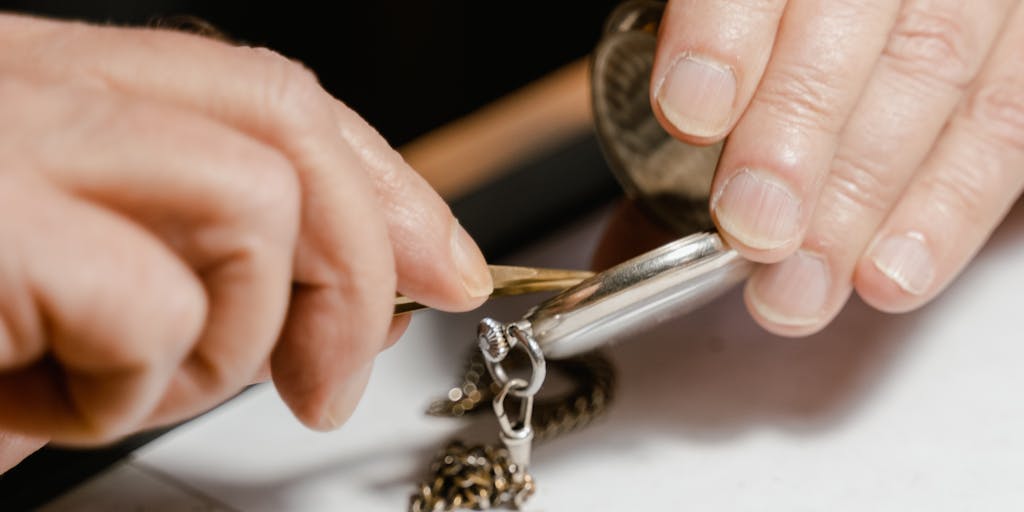 A close-up, top-down shot of a website sitemap rendered as a complex maze on a table. Tiny metallic ant-like robots (representing crawlers) traverse the paths toward nodes that glow. A vintage magnifying glass and a pocket watch lie on the maze to symbolize inspection and timing. High-contrast lighting and a slightly desaturated color palette give a clever, editorial look about crawl frequency and site structure.