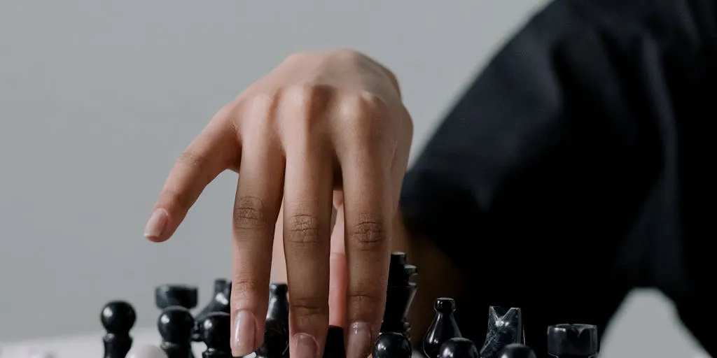 A close-up of a chessboard where pieces are replaced by tags representing SEO features (Schema, Sitemap, Redirects, Meta). The two opposing kings are labeled 'Yoast' and 'SEOPress', with a thoughtful strategist (hand hovering over a piece) in the background, conveying strategic product choice.